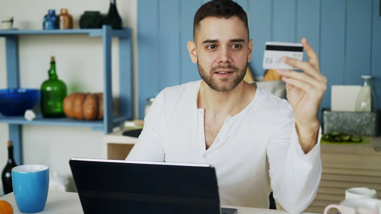 Man with laptop and credit card